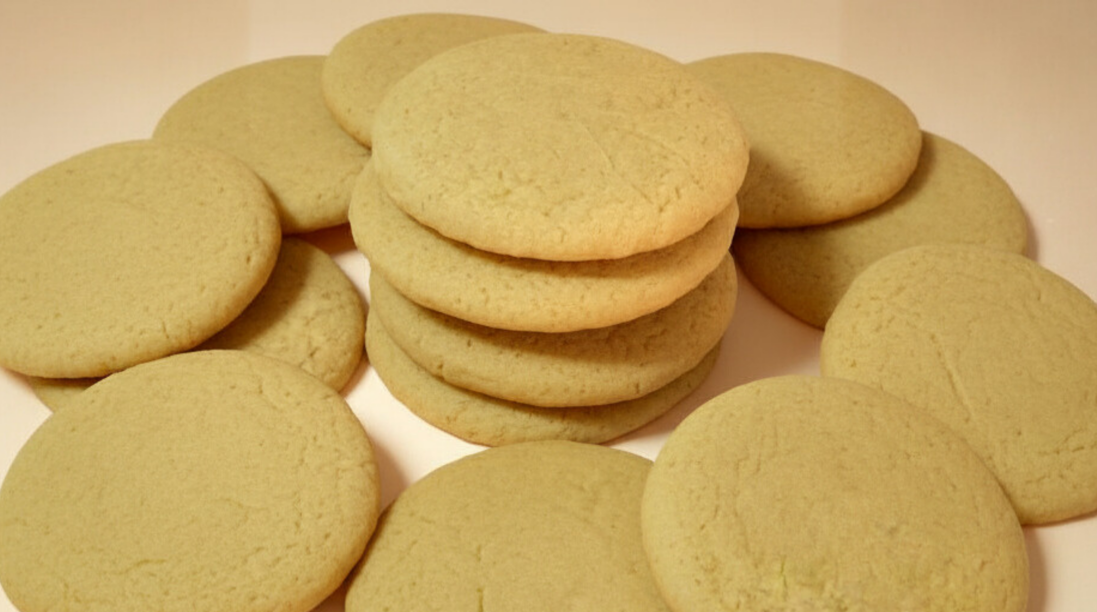 Stack of plain round cookies on a light background